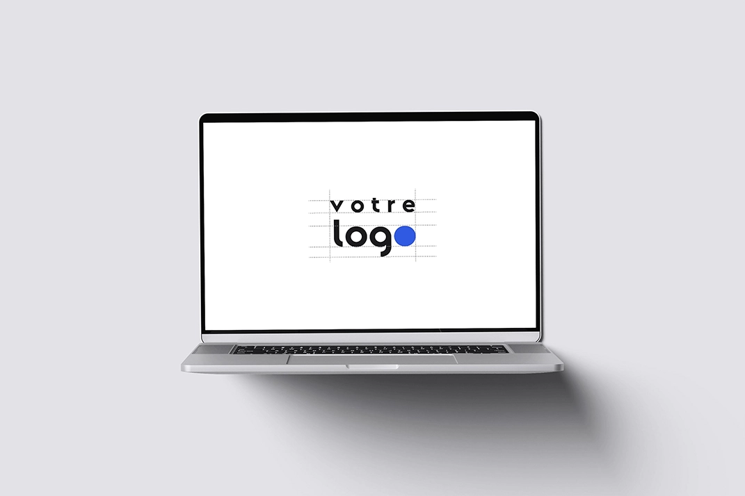 Maikkom conception logo - Écran ordinateur portable affichant création logo avec grille construction et guidelines